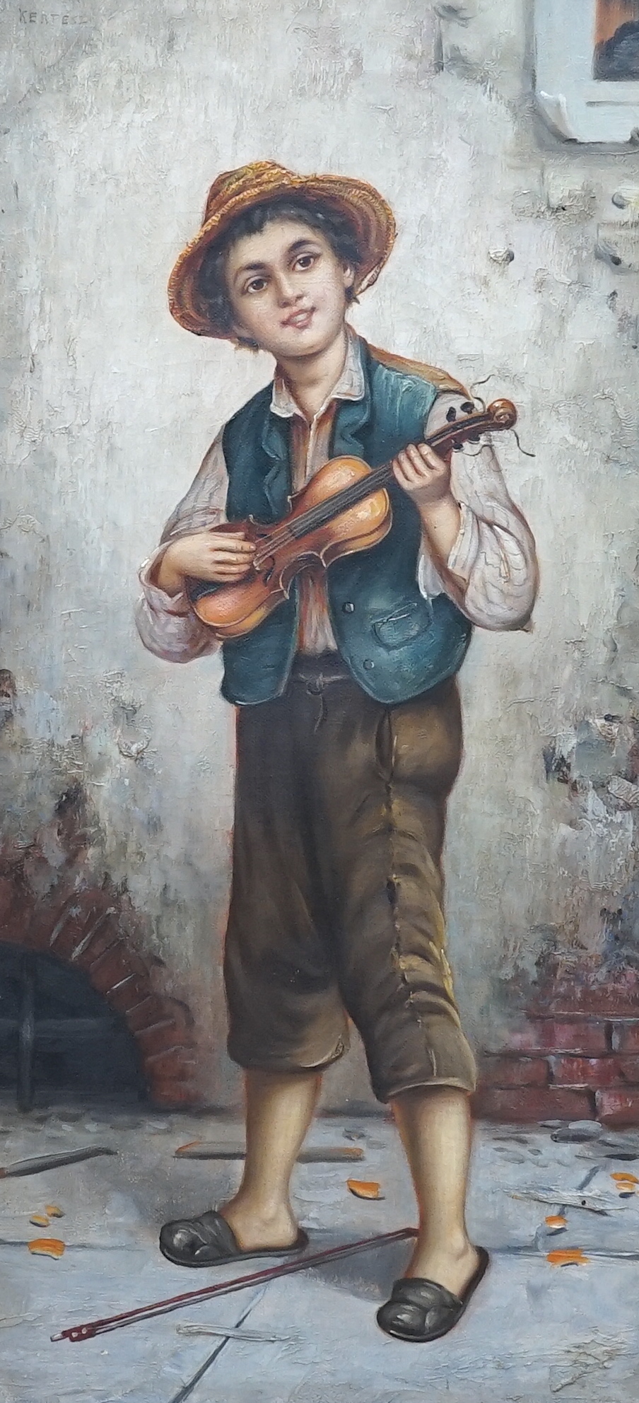 Kertesz, oil on canvas, Street urchin playing a violin, signed, 52 x 25cm